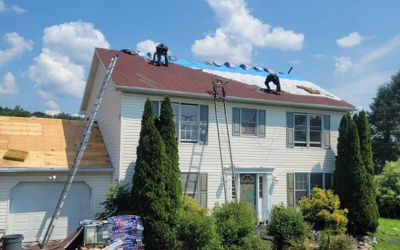 Roofers replacing roofing in Stroudsburg, PA.